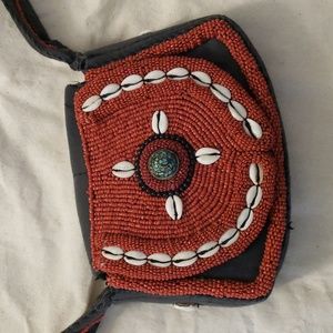 Beaded bag with shell accents.